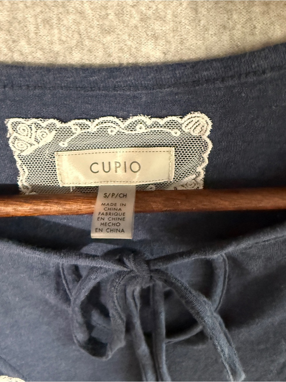 Cupio Navy Short-Sleeve Tie-Neck Top with White Floral Embroidery - Picture 2 of 7